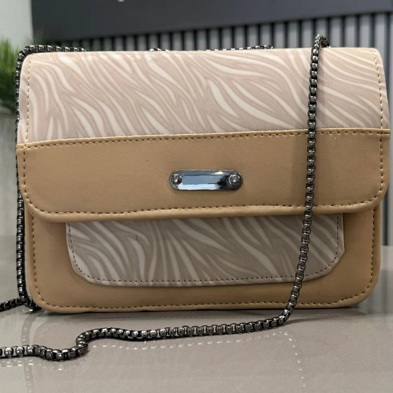 Beige faux leather shoulder bag detail view